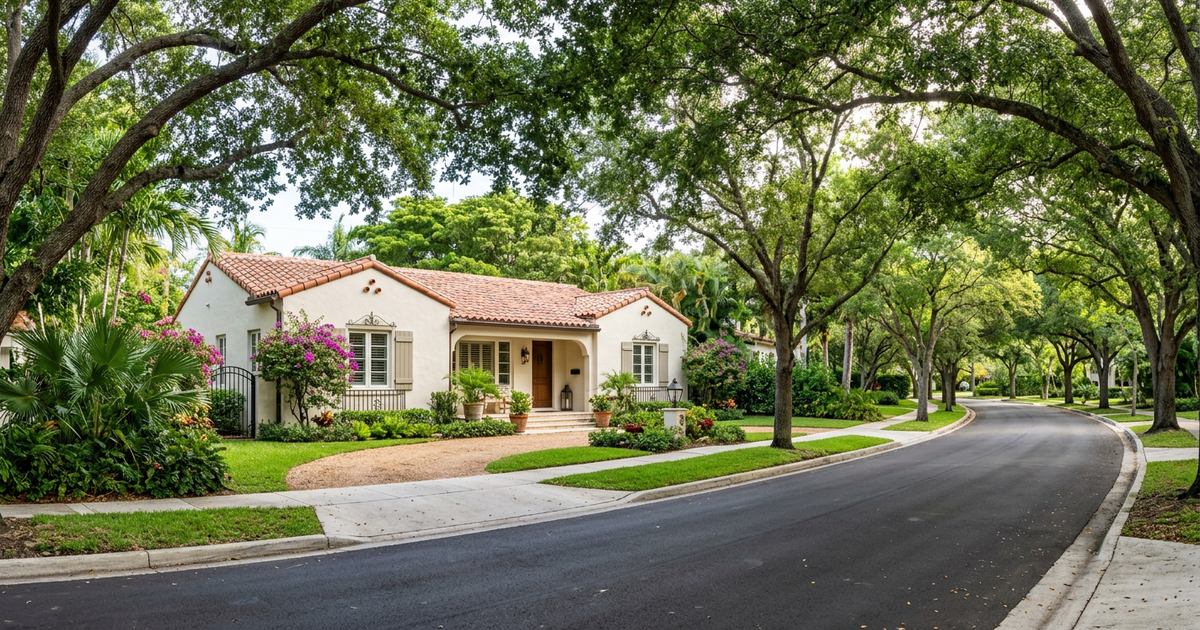 Tree-lined Coral Gables street with Mediterranean luxury home - Miami move-up sellers rate lock market 2025.